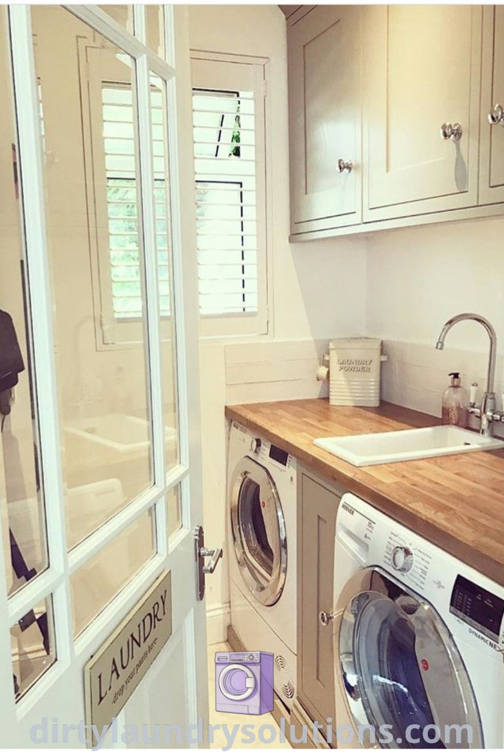 A washer and dryer in a small utility room alongside a compact utility sink and organized laundry storage. Explore inspiring solutions and cozy ideas for your home at dirtylaundrysolutions.com.