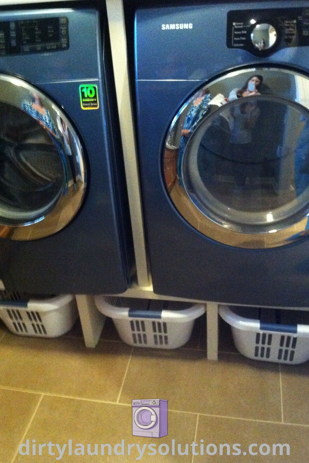 Two stacked washers in a cozy hidden laundry room with hidden baskets, showcasing unique ideas for organization in narrow spaces and tiny houses. Discover more solutions and inspirations for your home at dirtylaundrysolutions.com.