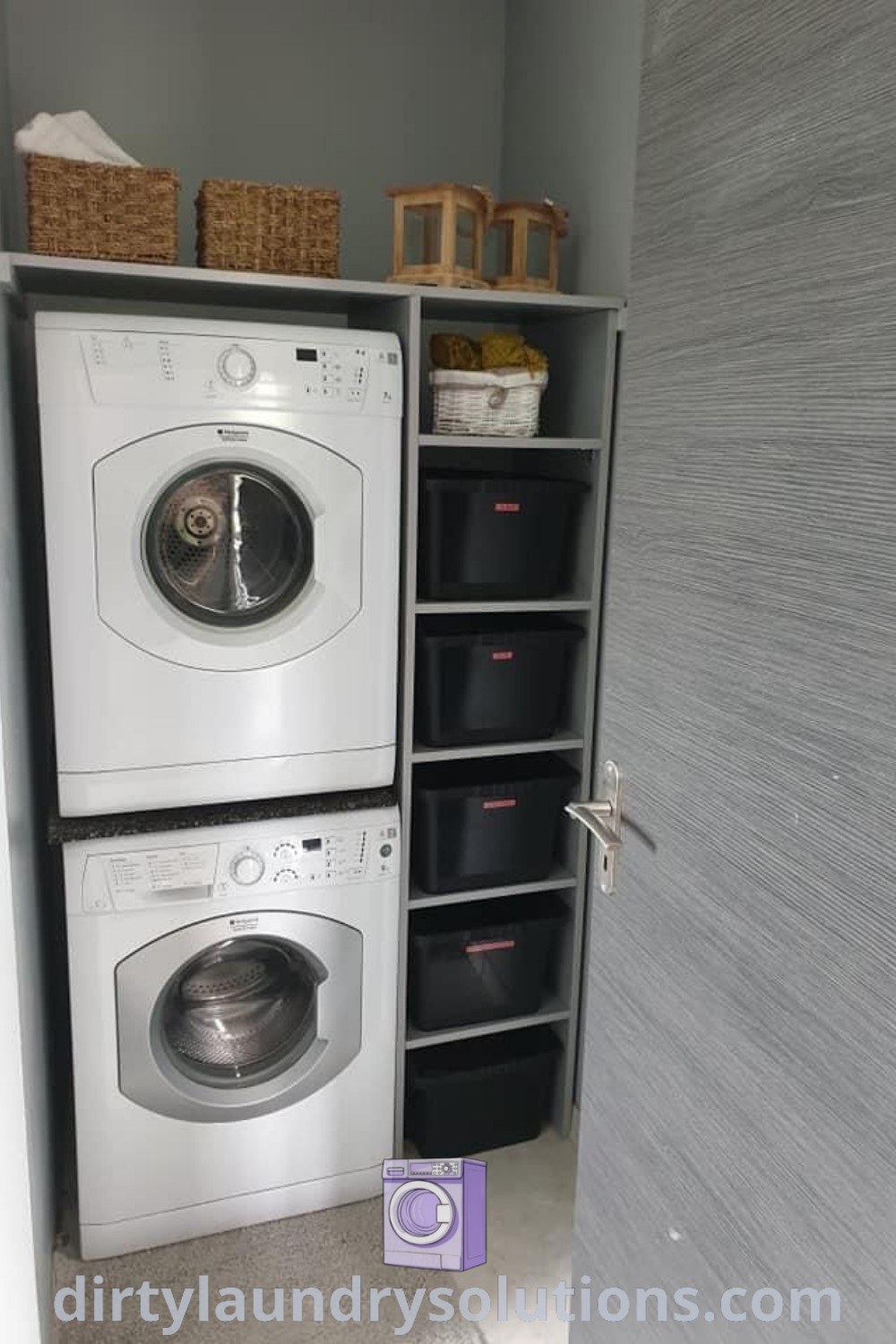 A cozy laundry room with a washer and dryer side by side, featuring baskets on shelves for smart organization. Discover more ideas for your home and small utility room inspiration at dirtylaundrysolutions.com.