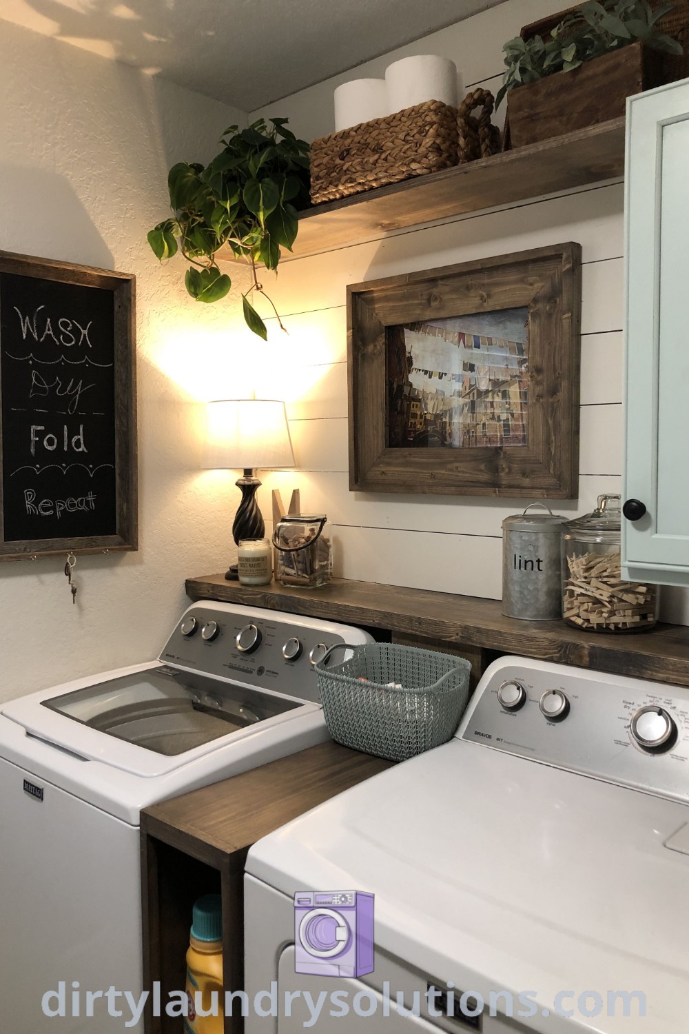A cozy laundry room and bathroom combo with a washer and dryer side by side, featuring white walls and ideas for small spaces that enhance organization and functionality. Discover more inspiring solutions for your home at dirtylaundrysolutions.com.
