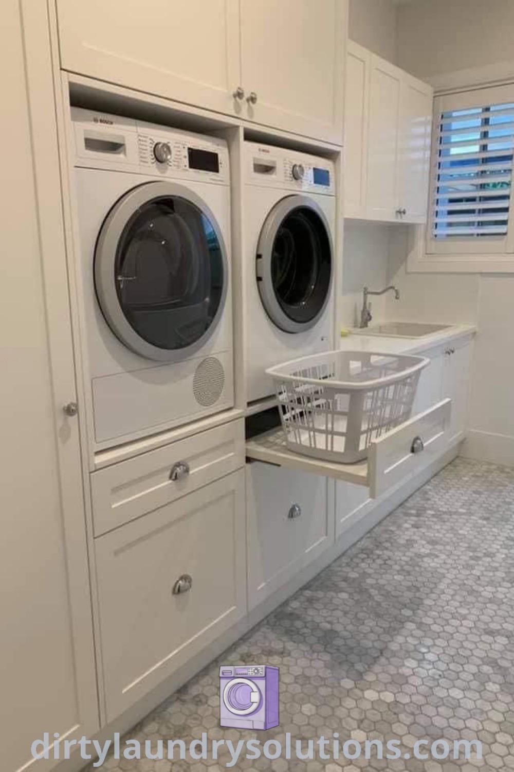 A stylish laundry room with a white washer and dryer, featuring cozy organization ideas and an elegant cottage aesthetic. Discover more designs and solutions for busy homes at dirtylaundrysolutions.com.