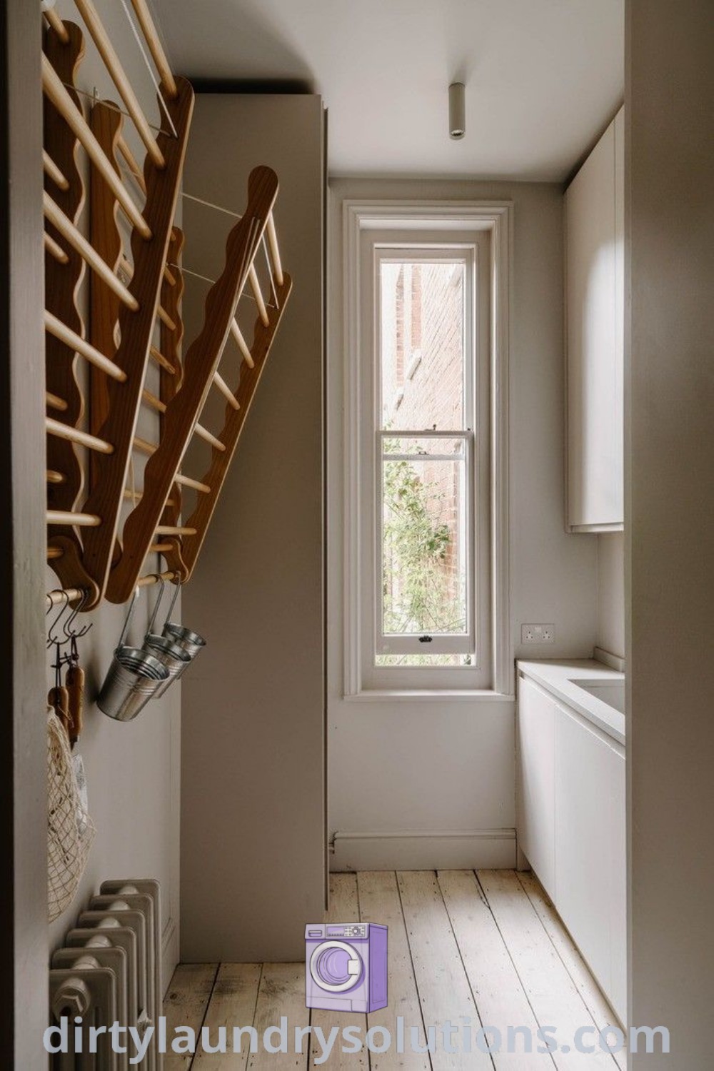 A clean and organized utility room featuring a light color palette, perfect for use as a laundry room or mudroom. This design showcases cozy ideas and organization solutions ideal for English apartments. Discover more inspirations for small spaces at dirtylaundrysolutions.com.