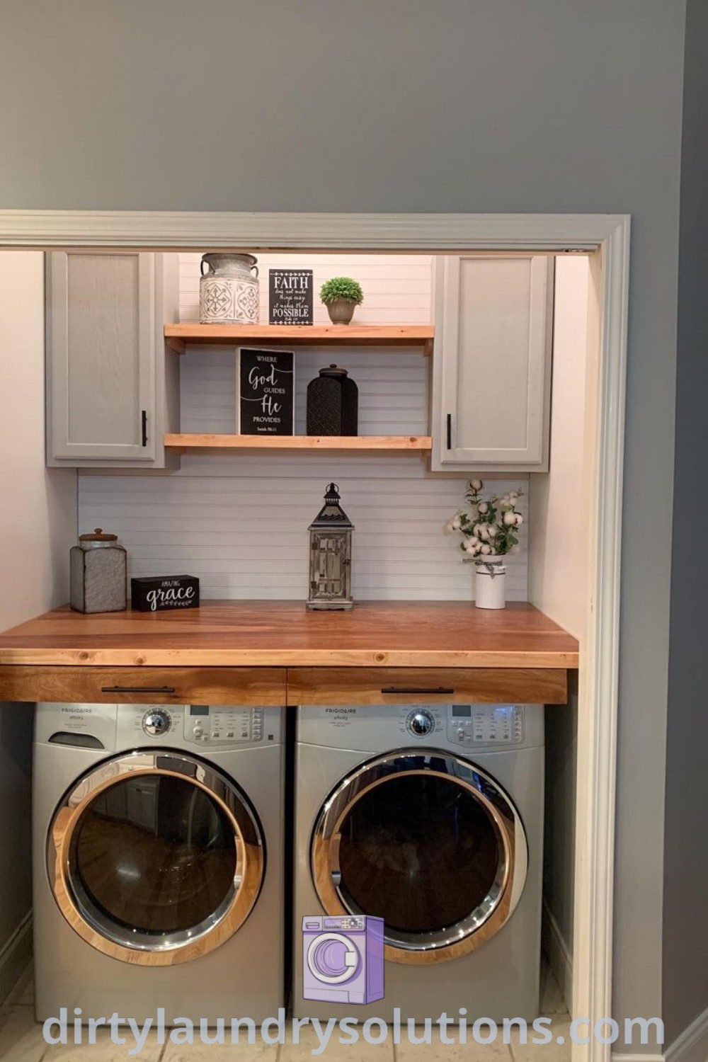 A small laundry room featuring a cozy layout with a navy blue washer and dryer, countertop above appliances, and shiplap accents. Explore inspiring laundry room ideas with dark appliances and organization tips at dirtylaundrysolutions.com.