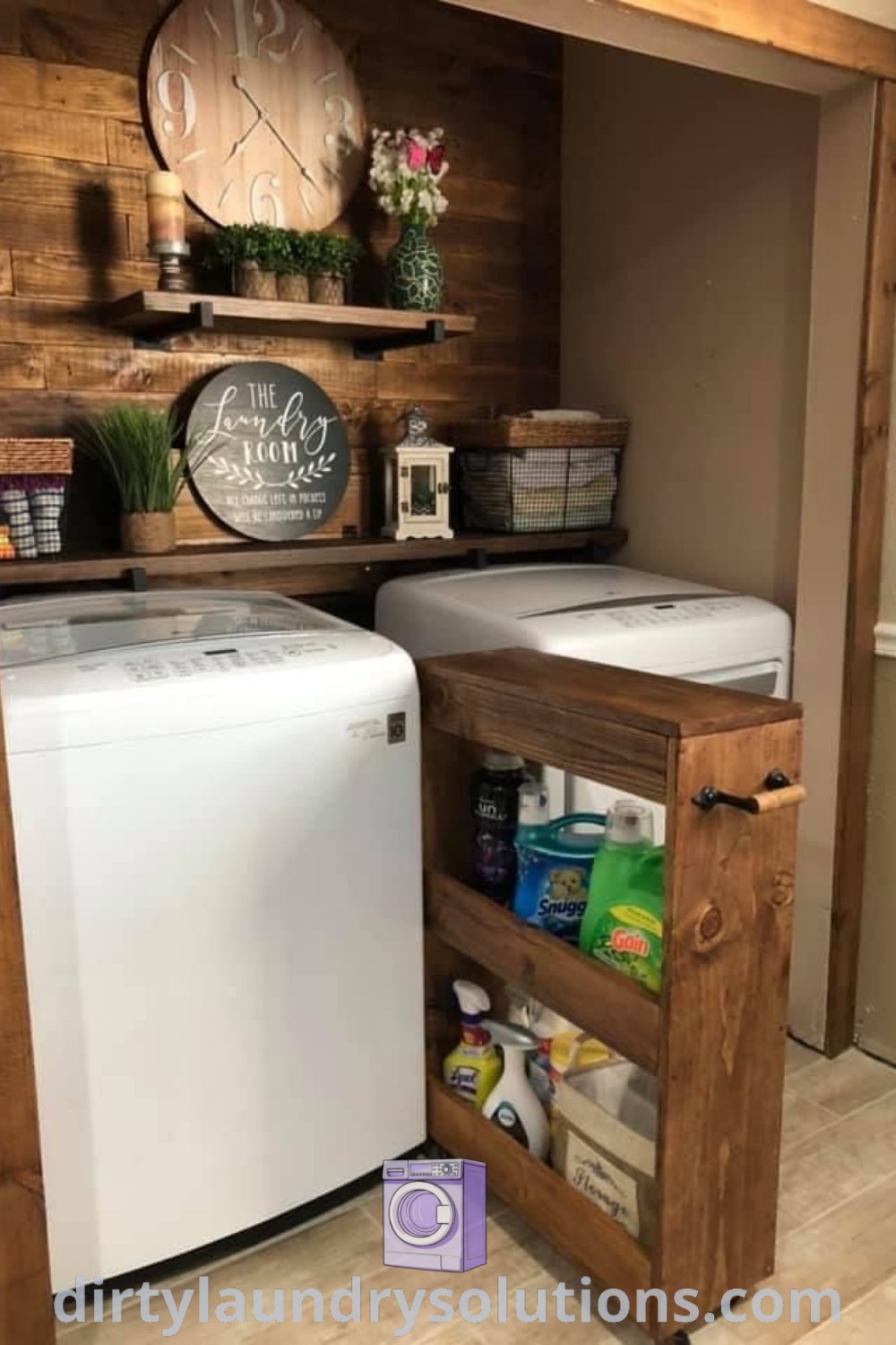 A small kitchen with a washer and dryer in the corner next to a wall-mounted clock, showcasing cozy laundry room decor and organization ideas. Discover inspiring laundry room remodels and tips at dirtylaundrysolutions.com.