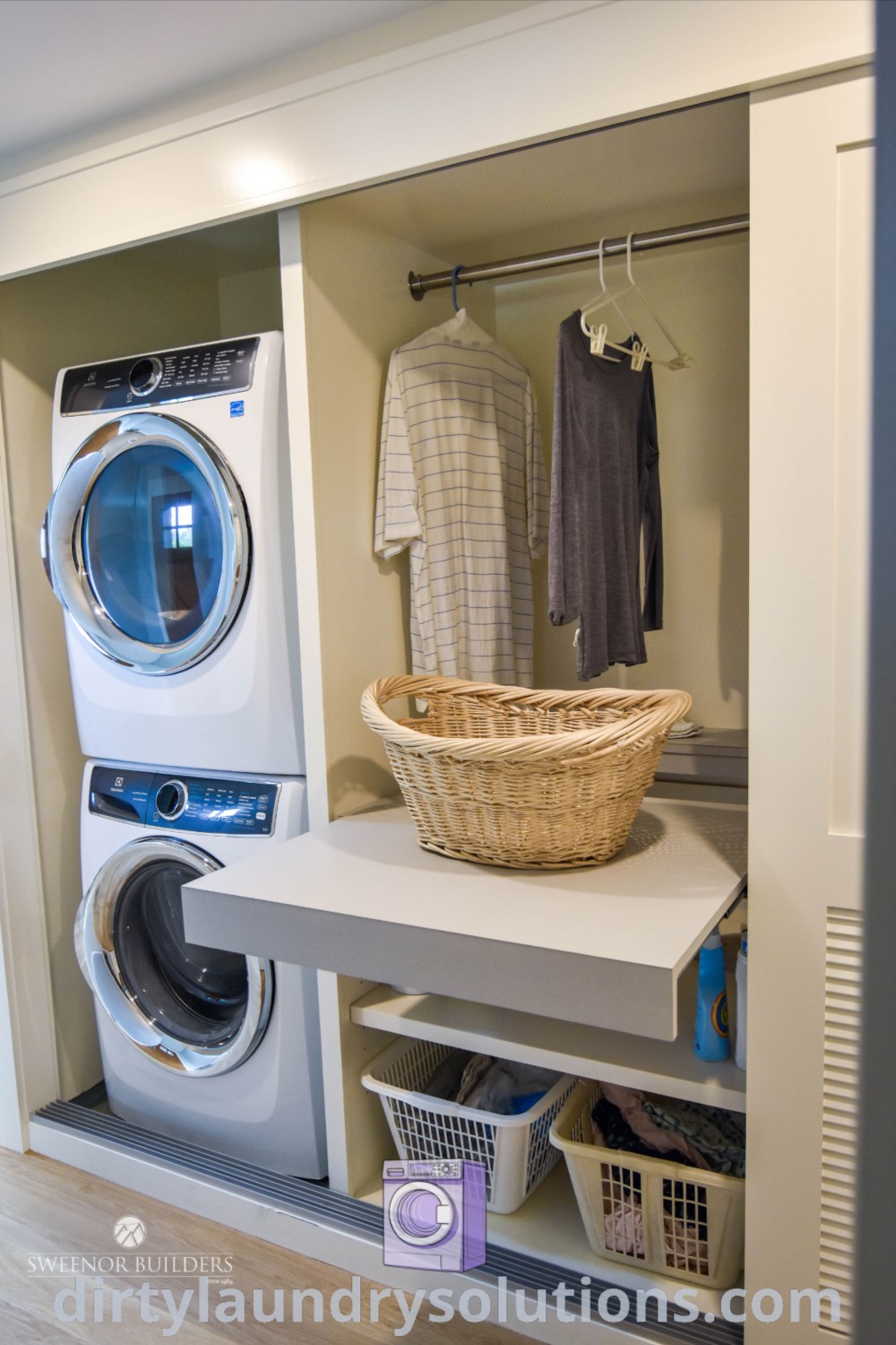 A cozy hallway laundry closet featuring a stacked washer and dryer with clothes hanging on a rack, demonstrating effective use of space. Discover inspiring closet laundry room ideas and solutions at dirtylaundrysolutions.com.