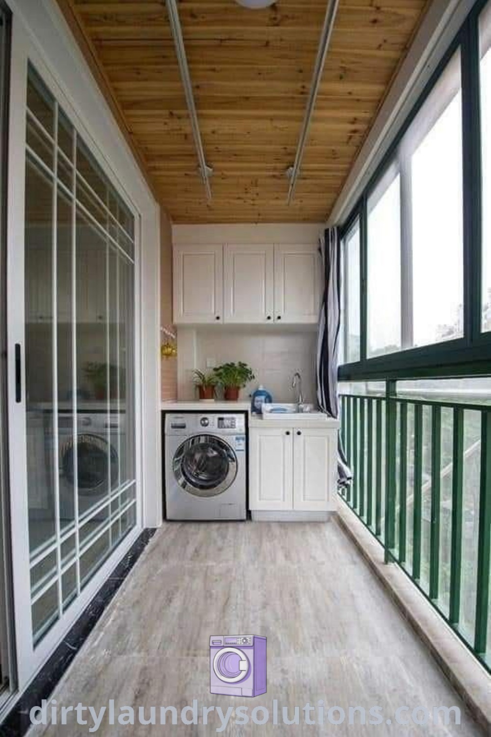A cozy outdoor laundry room with a washer and dryer positioned on a wooden floor next to windows, showcasing inspiring balcony decor ideas. Enhance your outdoor laundry experience with functional designs and solutions at dirtylaundrysolutions.com.