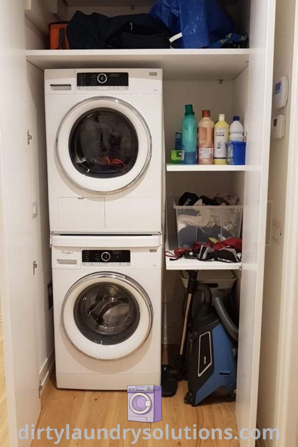 A white washer and dryer in a stylish closet with laundry shelves and cabinets, showcasing practical organization ideas for trilevel homes. Discover more inspiring laundry solutions at dirtylaundrysolutions.com.