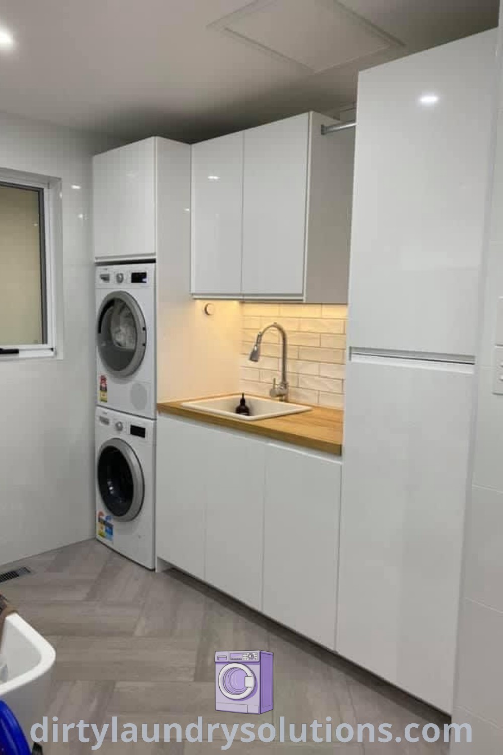 A cozy utility room featuring a washer and dryer, showcasing inspiring laundry ideas for small spaces, emphasizing organization and aesthetic charm. Discover more unique ideas for your home at dirtylaundrysolutions.com.
