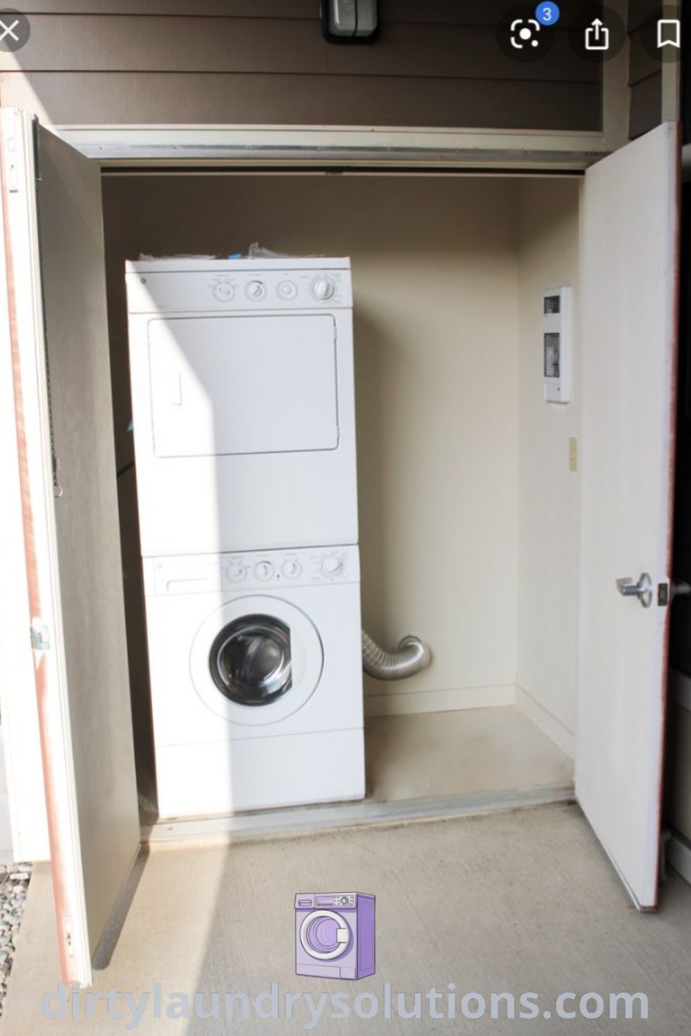 A washer and dryer in an empty room with an open door to another room, showcasing outdoor laundry room ideas that inspire organization and decoration for small spaces. Discover more about cozy home solutions at dirtylaundrysolutions.com.