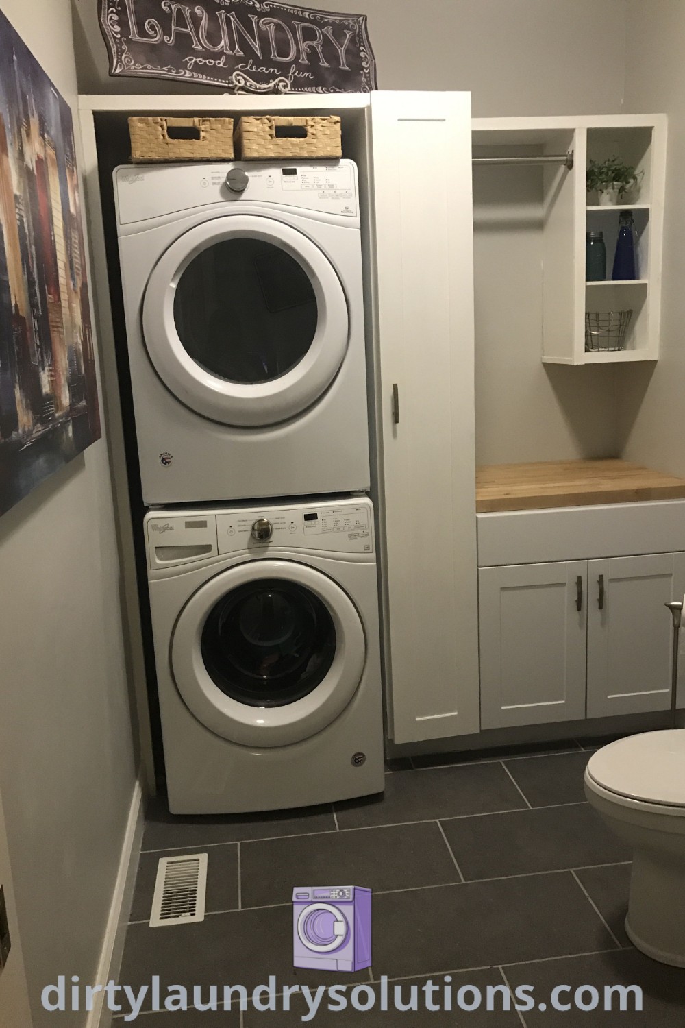 A small room featuring a washer and dryer with white cabinets that create a cozy laundry and half bathroom combo. This space balances functionality and style, providing organization ideas for busy homes. Discover inspiration and solutions for your laundry and powder room combo at dirtylaundrysolutions.com.