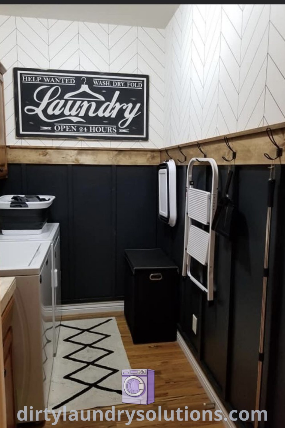 A modern laundry room featuring black cabinets and white walls, beautifully organized for efficiency. Discover inspiring laundry room renovation ideas and solutions at dirtylaundrysolutions.com.