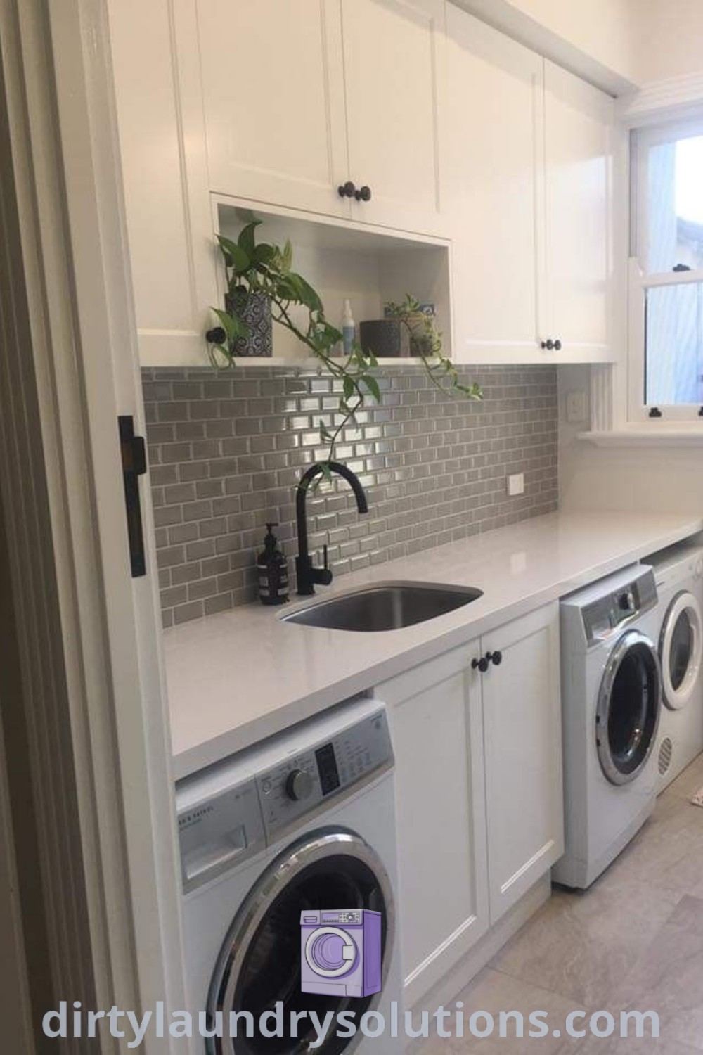 A cozy laundry room in a small kitchen featuring a washer and dryer, stylish laundry baskets, and an organized storage cabinet. Discover design ideas and cozy solutions for your home at dirtylaundrysolutions.com.