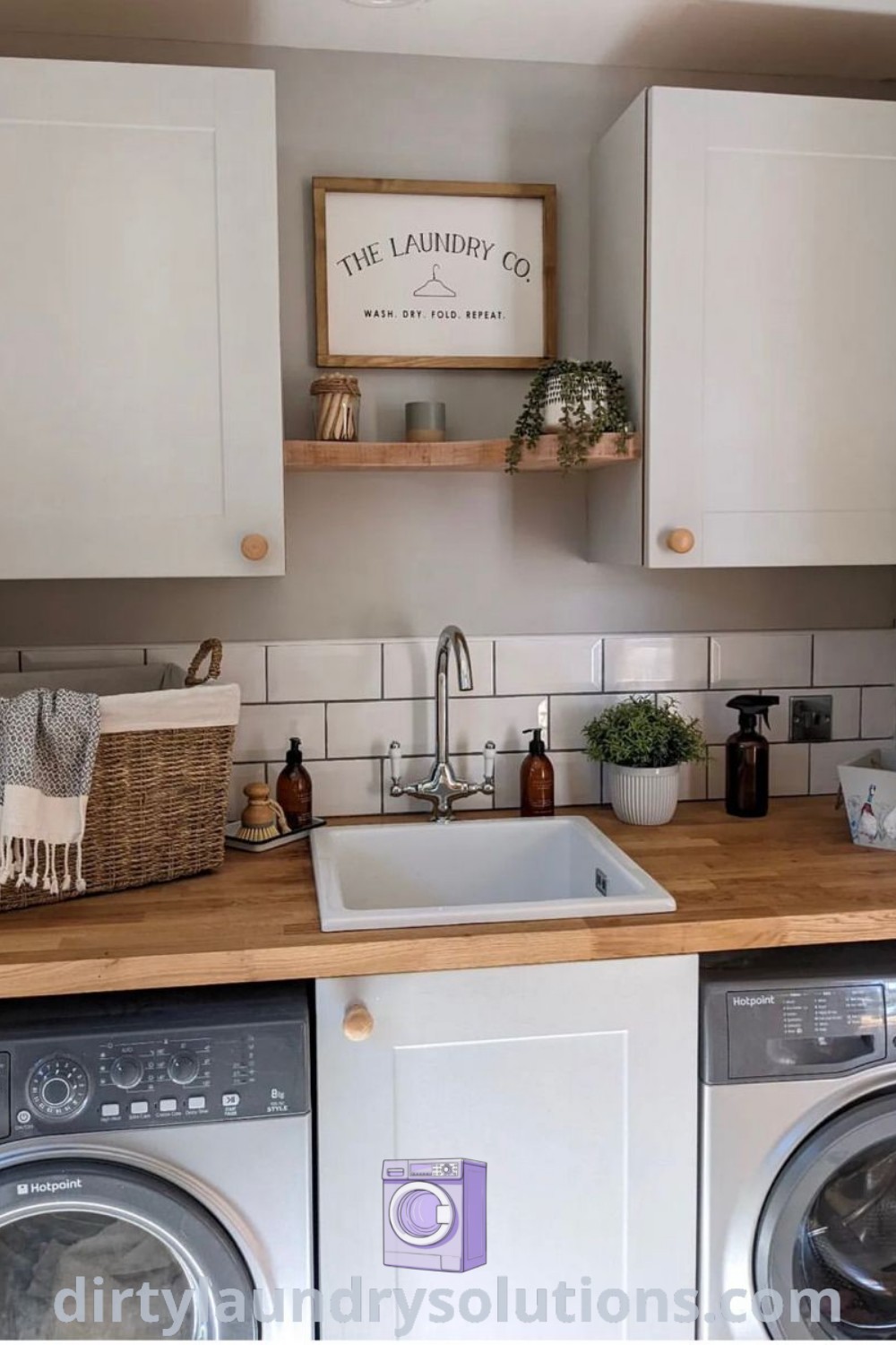 A clean and inviting small utility room with a sink, featuring elegant laundry room decorations and organized cabinets. Discover inspiring ideas for your home at dirtylaundrysolutions.com.