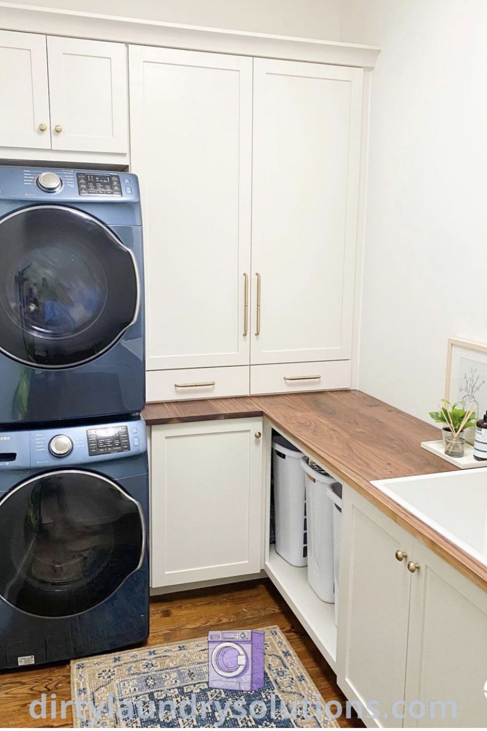 A small kitchen laundry room with a stacked washer and dryer, showcasing modern design and clever organization ideas. Explore cozy aesthetics and inspiring laundry renovation ideas at dirtylaundrysolutions.com.