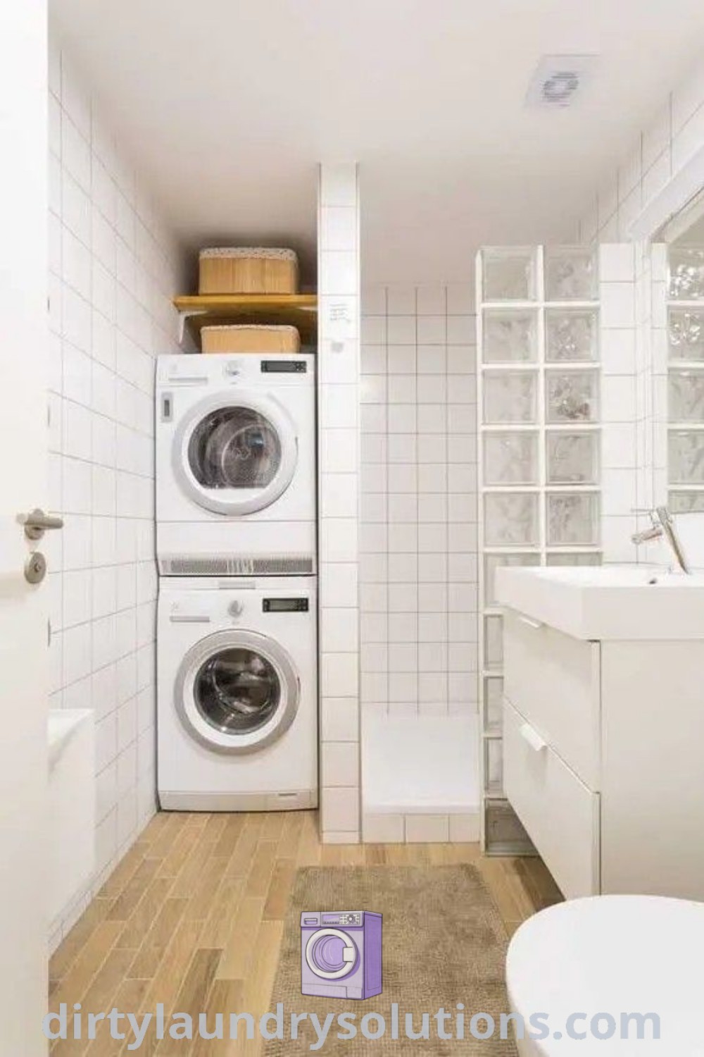 A small bathroom showcasing a washer and dryer setup with organized storage solutions, blending modern design and functionality. Explore more cozy ideas and inspiration for small bathroom laundry combos at dirtylaundrysolutions.com.