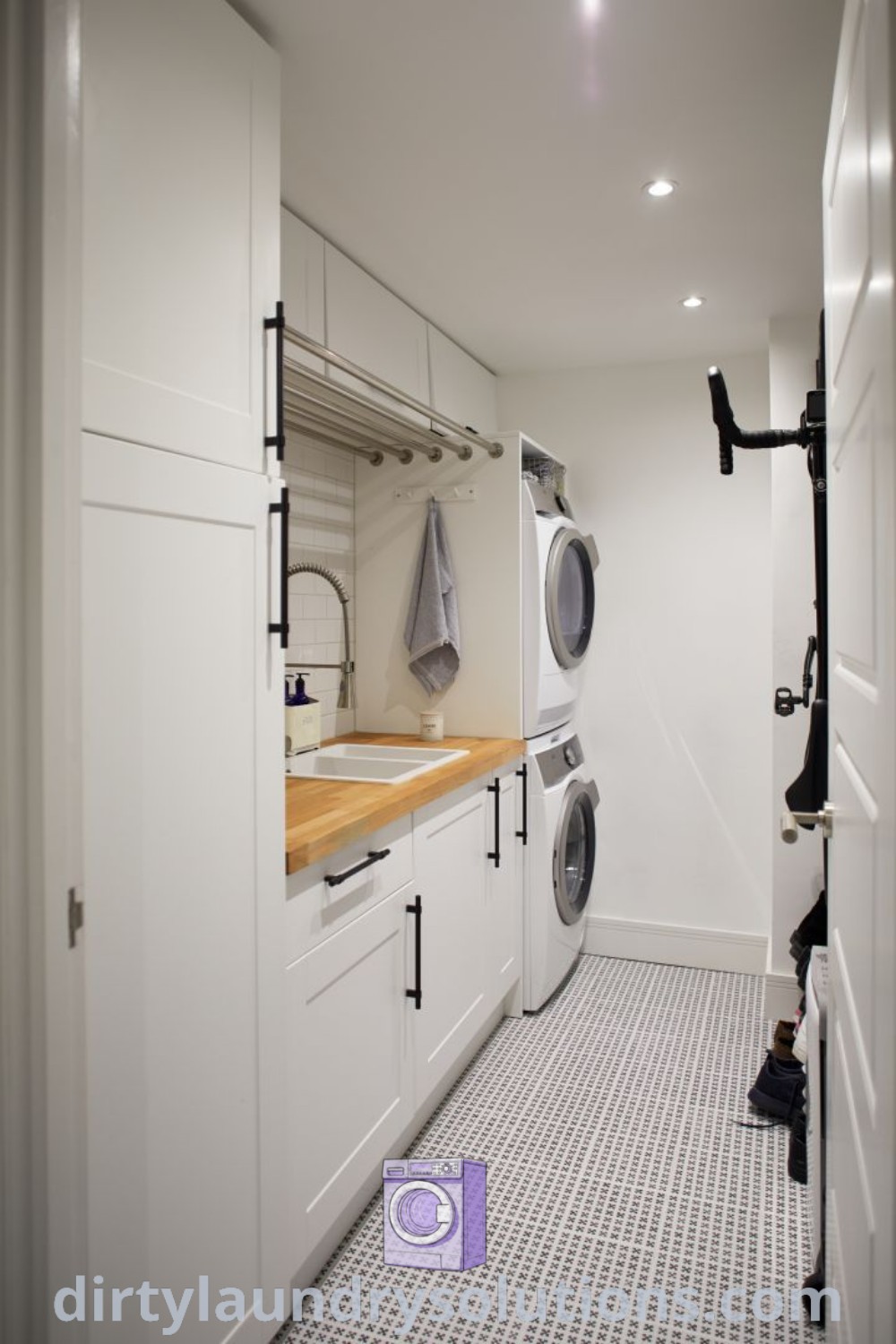 A small room featuring a white washer and dryer, designed for efficiency and organization. This cozy space optimizes functionality while providing stylish laundry solutions. Discover inspiring ideas for small spaces at dirtylaundrysolutions.com.