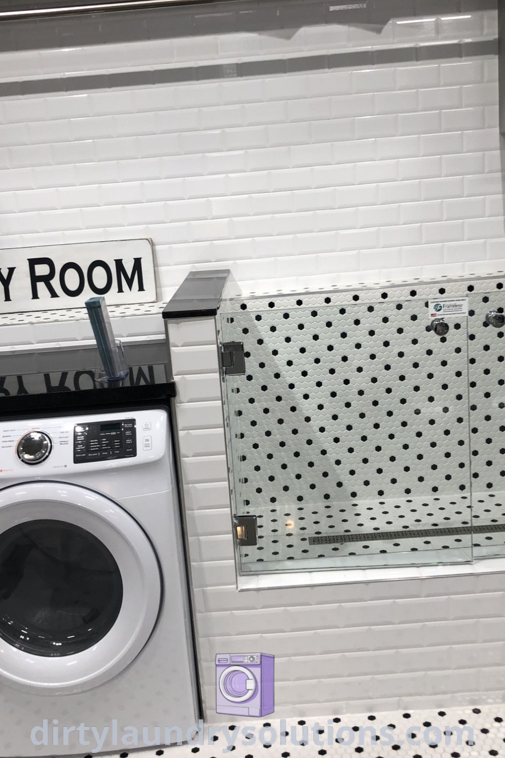 A dog washing sink next to a washer and dryer in a laundry pet room with white tile walls, highlighting effective organization solutions and inviting decor. Find more ideas for your cozy home at dirtylaundrysolutions.com.