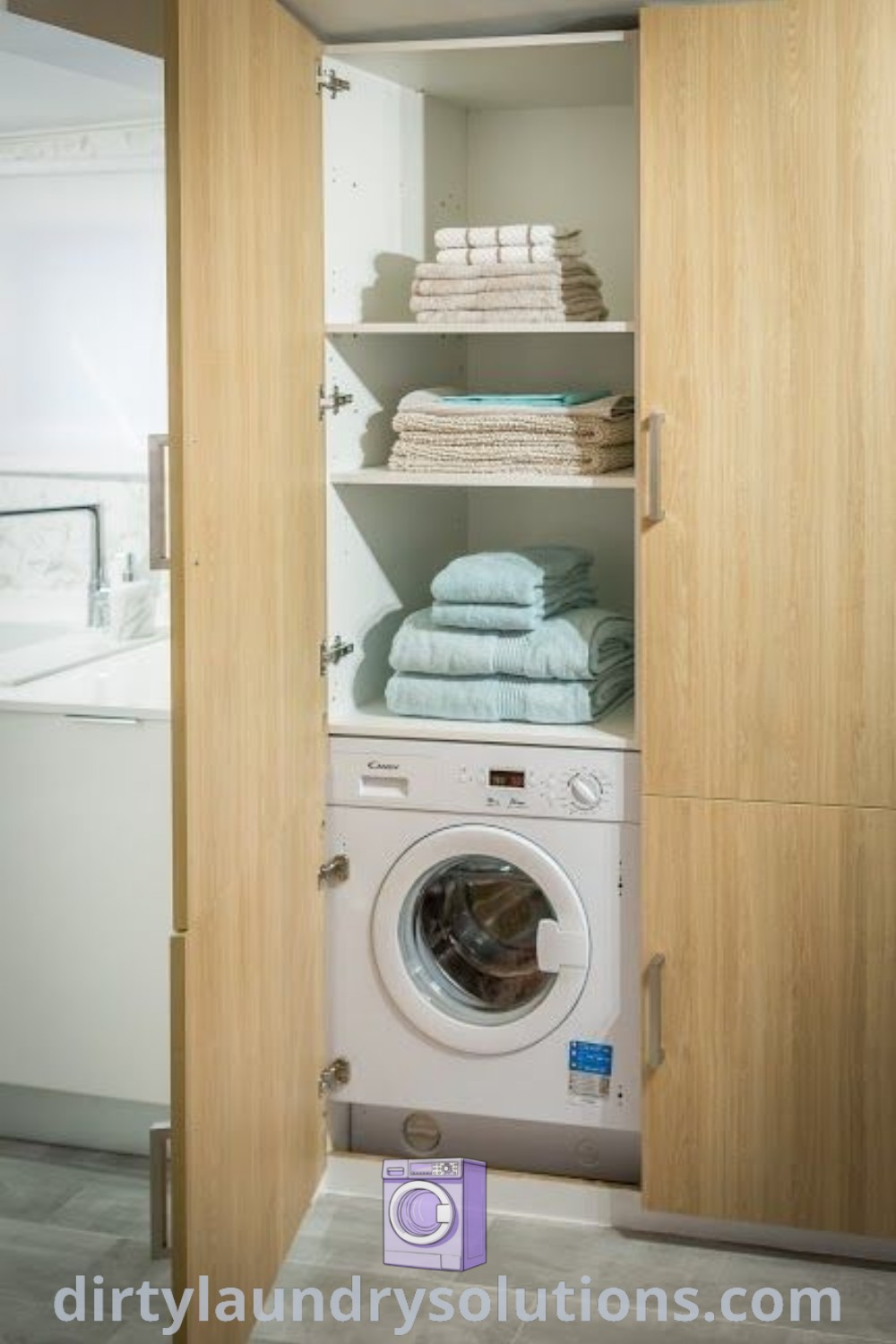 A laundry room featuring a washer and dryer with wooden shelves on either side of the door, offering stylish organization. Discover more design ideas and inspirations at dirtylaundrysolutions.com.