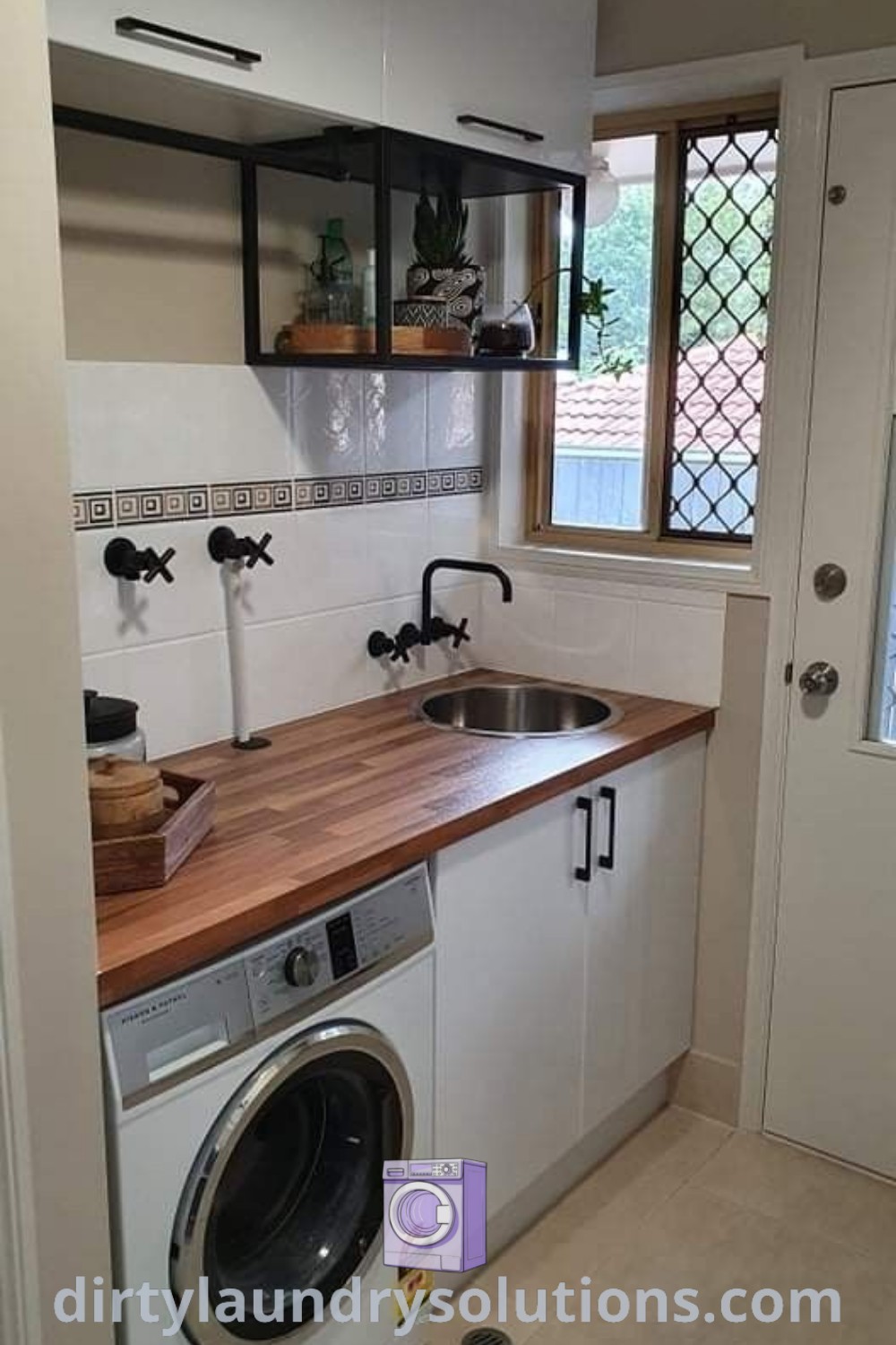 A washer and dryer in a small room with wood countertops, showcasing a cozy kitchen laundry combo that maximizes space and functionality. Discover inspiring ideas for small spaces and organization solutions at dirtylaundrysolutions.com.