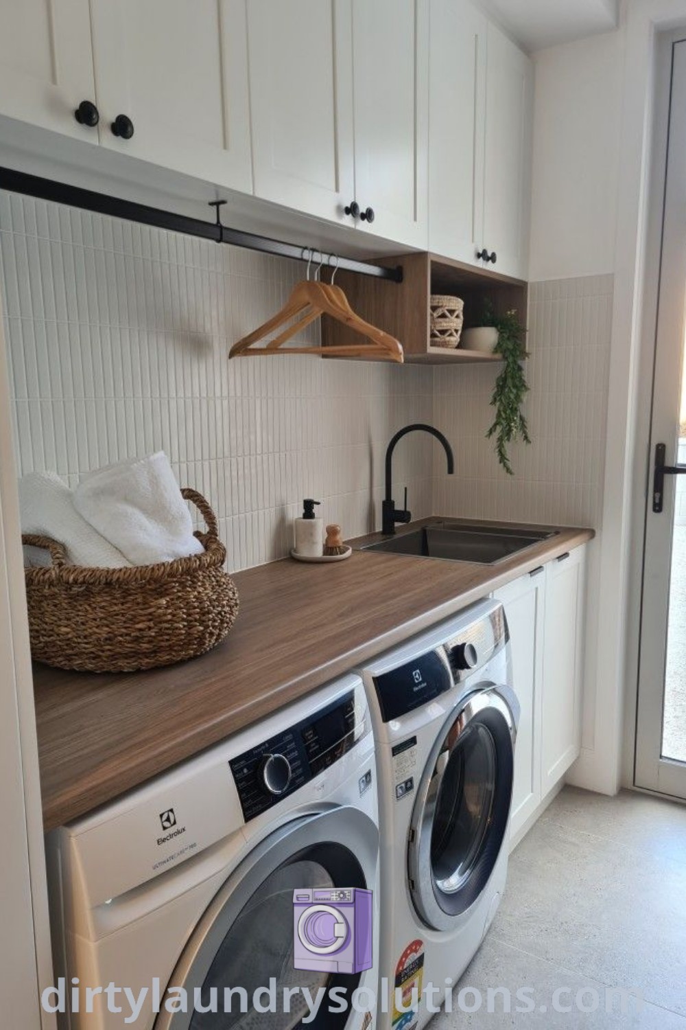 A cozy laundry room featuring a washer and dryer, a wood countertop, and a hanging rod in a closet, with inspiring design ideas and organization solutions for small spaces. Discover more unique house ideas at dirtylaundrysolutions.com.