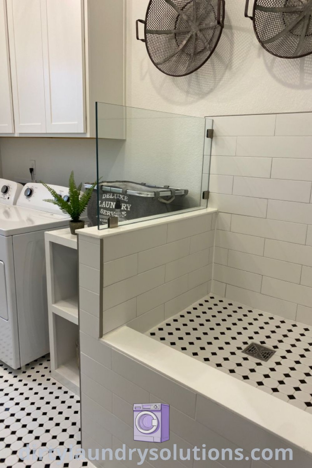 A washer and dryer in a room with black and white tile flooring, showcasing an elegant laundry dog wash area designed for dog grooming. Explore more unique ideas for your home at dirtylaundrysolutions.com.
