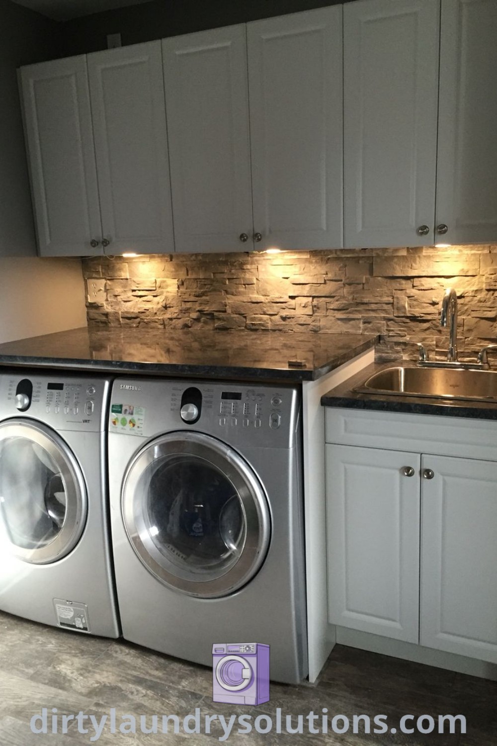 A small kitchen with a washer and dryer, showcasing organized cabinets and cozy design ideas for a laundry room. Explore inspiring laundry room color ideas and solutions at dirtylaundrysolutions.com.