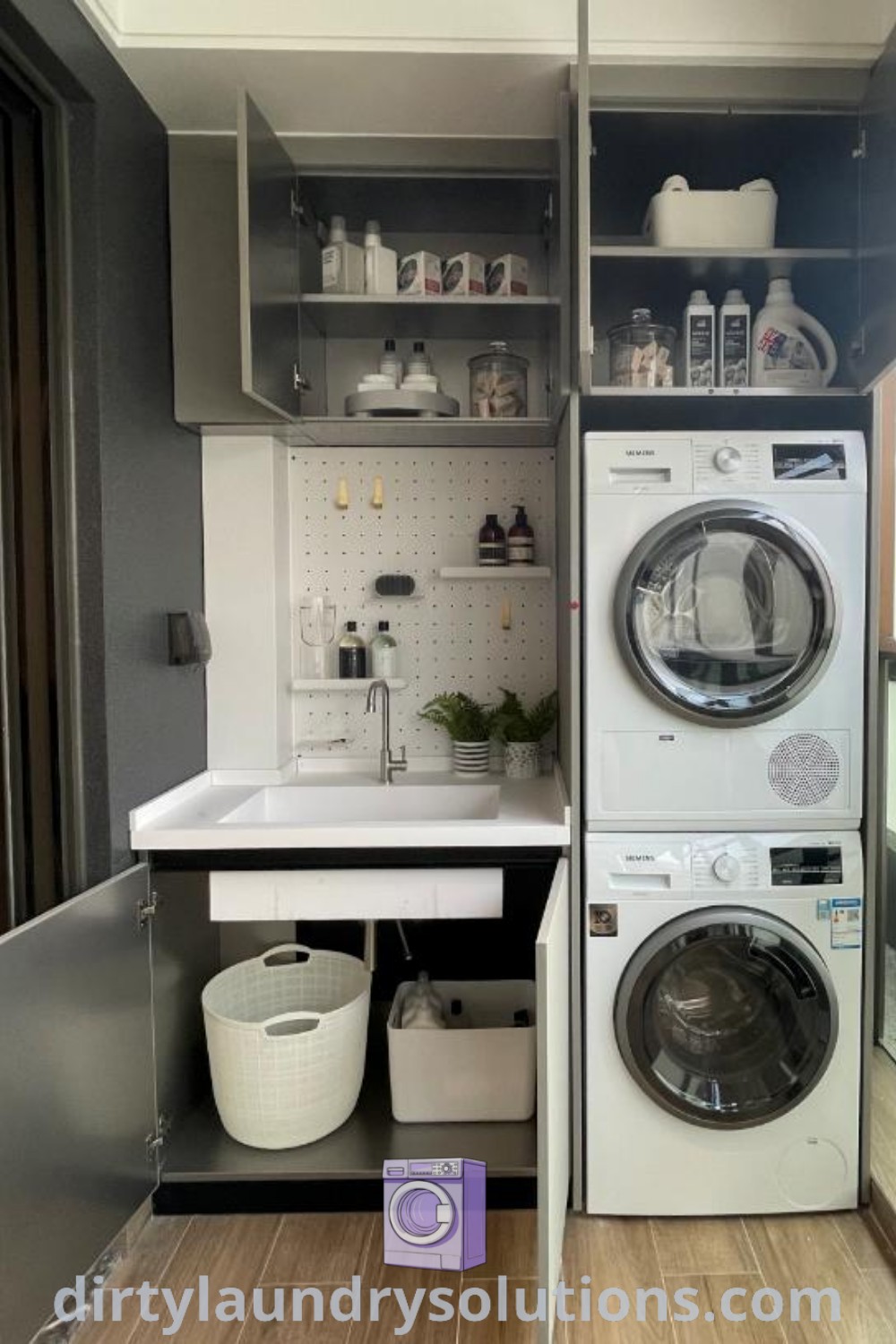 A small utility room featuring a washer and dryer along with open shelving, designed for optimal organization. This cozy space serves as an inspiring example of efficient laundry room redesign and storage solutions. Discover more inspiring ideas for your home at dirtylaundrysolutions.com.