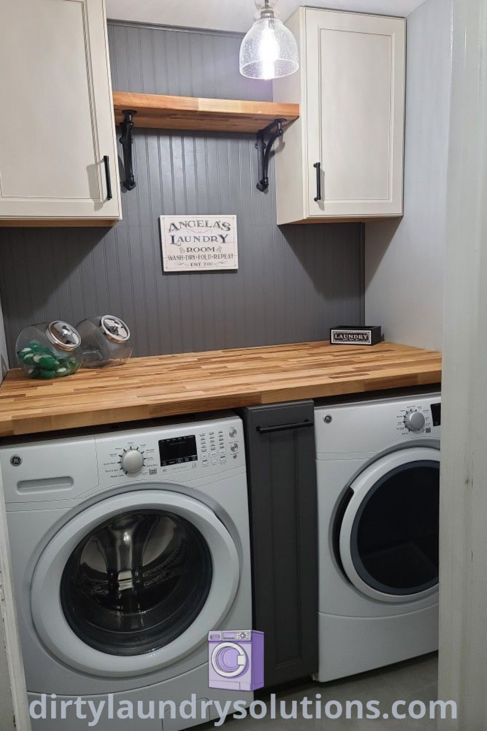 A washer and dryer in a small room with white cupboards on the wall, highlighting cozy ideas and smart organization. Explore more inspiring laundry room design ideas at dirtylaundrysolutions.com.