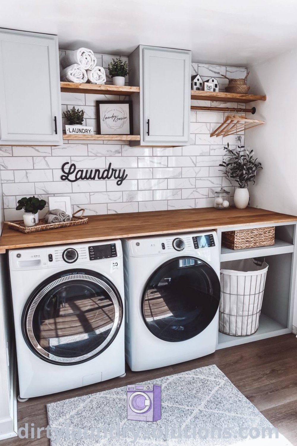 A cozy small laundry room featuring a washer and dryer surrounded by white tile walls, highlighting modern design and organization ideas. Discover stylish solutions and unique ideas for your home at dirtylaundrysolutions.com.