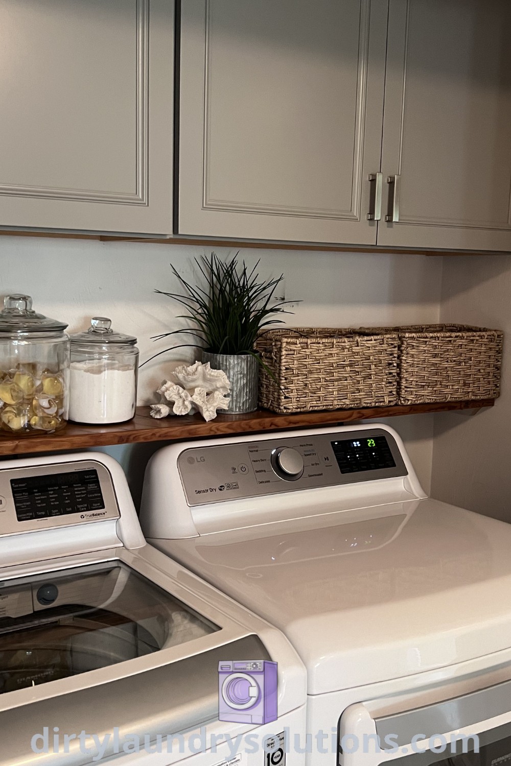 A cozy laundry closet featuring a washer and dryer side by side, complemented by stylish cabinets, showcasing inspiring ideas for laundry room updates. Discover more unique solutions and organization ideas at dirtylaundrysolutions.com.