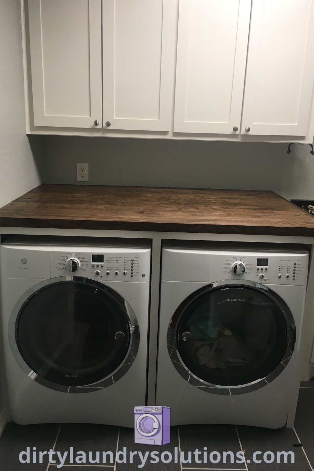 A cozy laundry room featuring a washer and dryer, a utility sink, and white cabinets for optimal storage solutions. Discover stylish ideas for small spaces and laundry room designs at dirtylaundrysolutions.com.