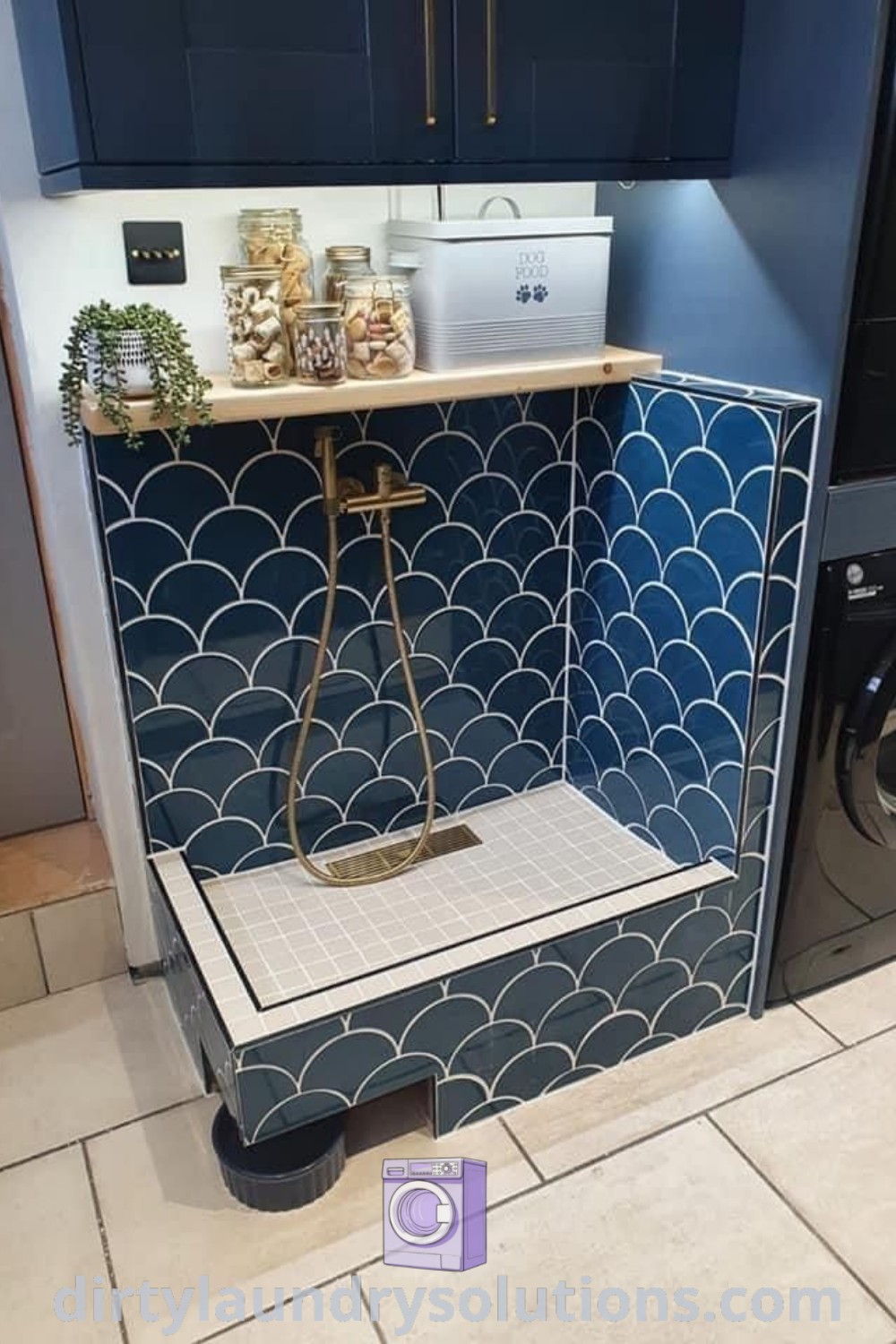 A cozy laundry room showcasing a washer and dryer with blue tiled walls, perfect for integrating dog home ideas, dog showers, and wash station solutions for effective organization. Discover more inspiring and functional designs at dirtylaundrysolutions.com.