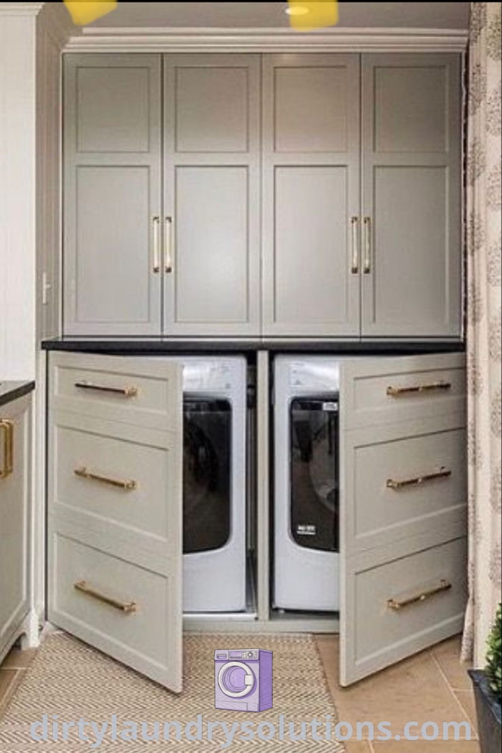 A stylish kitchen featuring a washer and dryer between white cabinets, showcasing a hidden laundry solution that harmonizes functionality and design. Discover laundry room inspirations and ideas for your home at dirtylaundrysolutions.com.