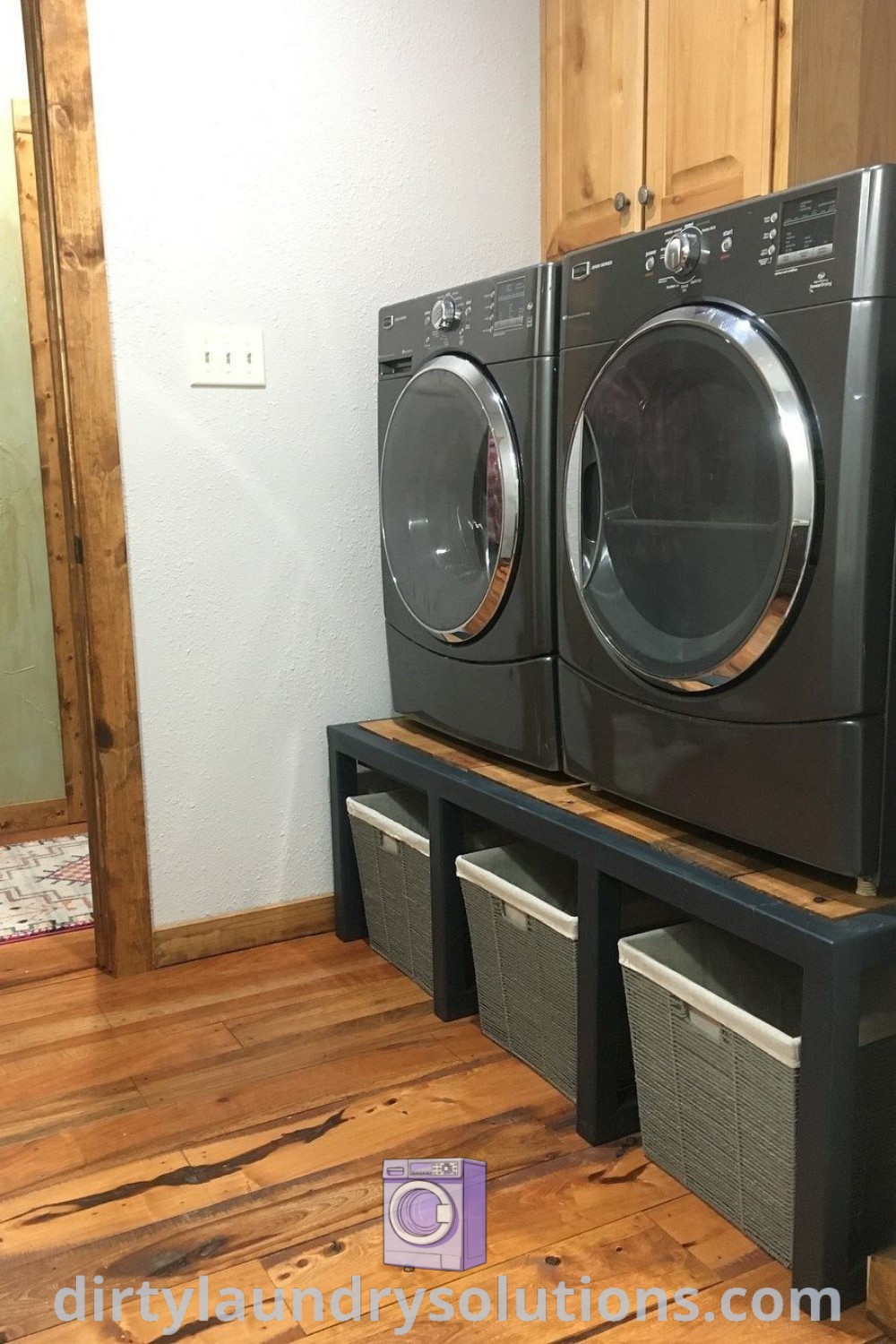 A washer and dryer stacked in a cozy laundry room, complete with shelves for organization and design ideas from dirtylaundrysolutions.com. Explore washer and dryer remodels, simple laundry room aesthetics, and budget-friendly makeover solutions.