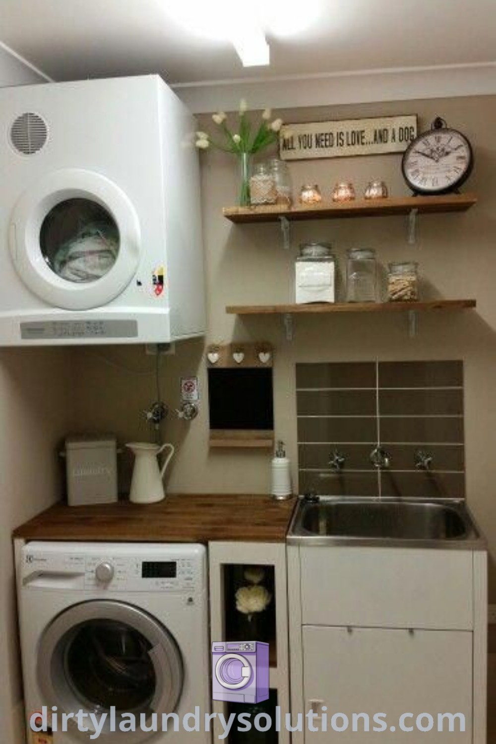 A cozy laundry room with a washer and dryer side by side, complemented by wall shelves that offer ample storage. Discover inspiring laundry room organization ideas and solutions at dirtylaundrysolutions.com.