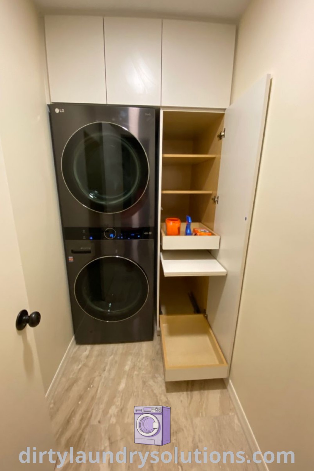 A cozy laundry room featuring a stackable washer and dryer in the corner, complemented by white walls and organized storage. Discover inspiring ideas and solutions for small spaces at dirtylaundrysolutions.com.