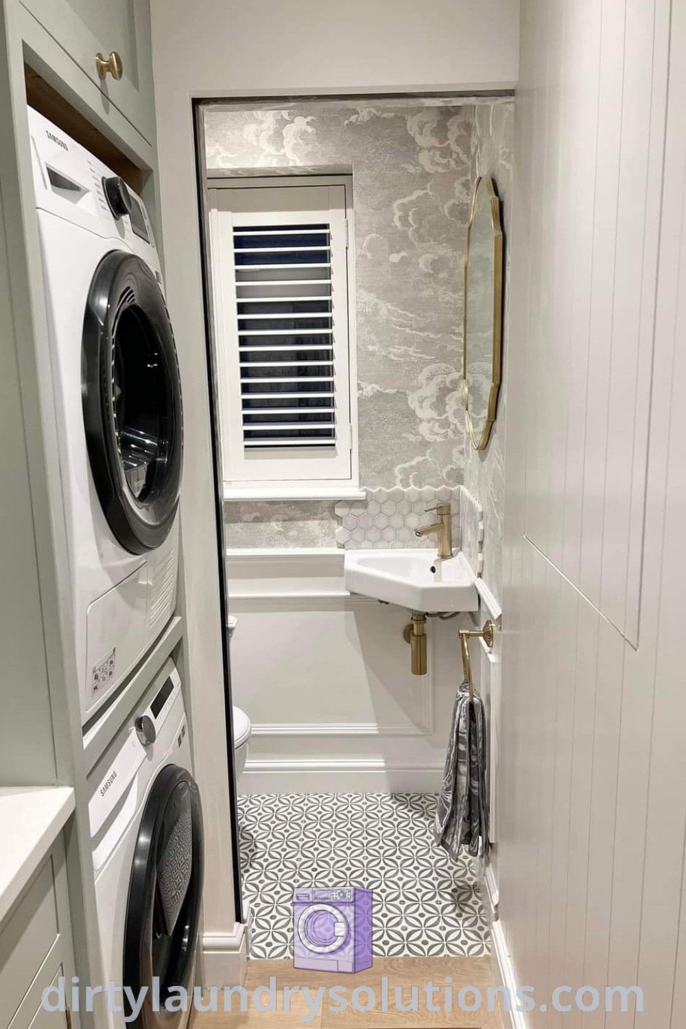 A small laundry room in a bathroom featuring a washer and dryer against white walls and wood flooring, showcasing efficient organization ideas for compact spaces. Discover unique solutions at dirtylaundrysolutions.com.