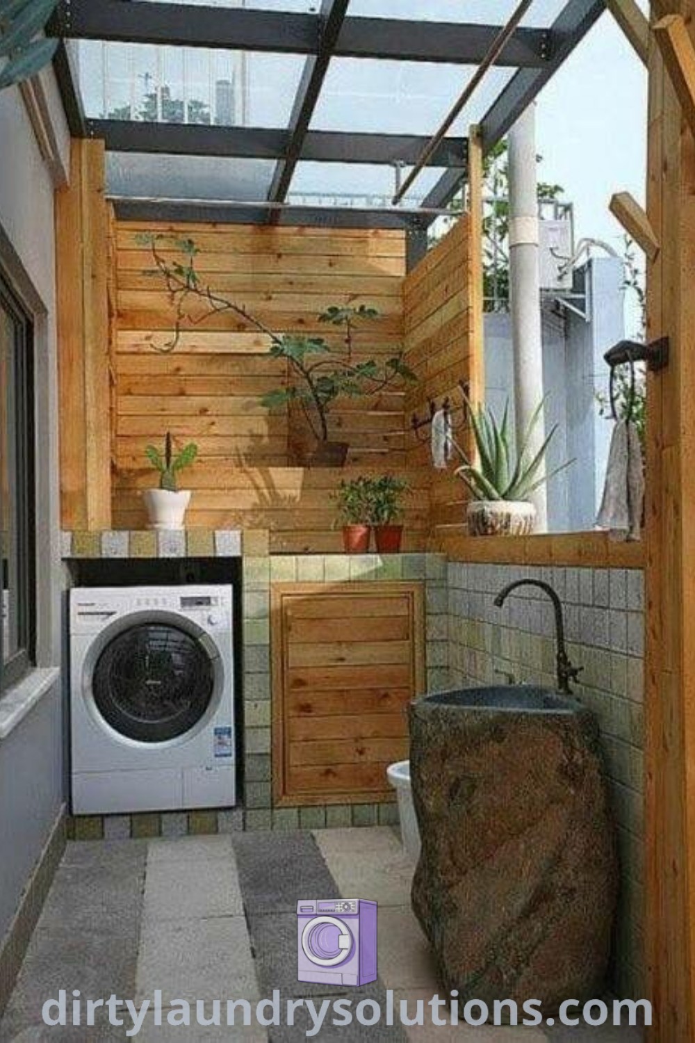 A small outdoor laundry room showcasing a washer and dryer surrounded by wood paneling, highlighting cozy aesthetic and organization ideas. Discover more outdoor laundry designs and solutions for small spaces at dirtylaundrysolutions.com.