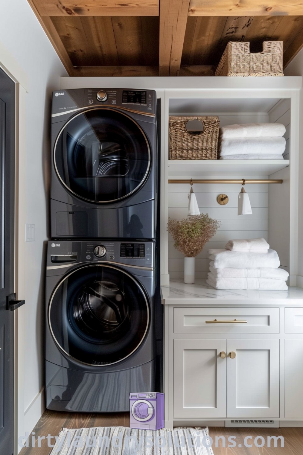 A cozy laundry room featuring a stacked washer and dryer in a white aesthetic with wood ceilinging and open shelving, ideal for small spaces. Discover inspiring laundry room design ideas and solutions for effective organization at dirtylaundrysolutions.com.