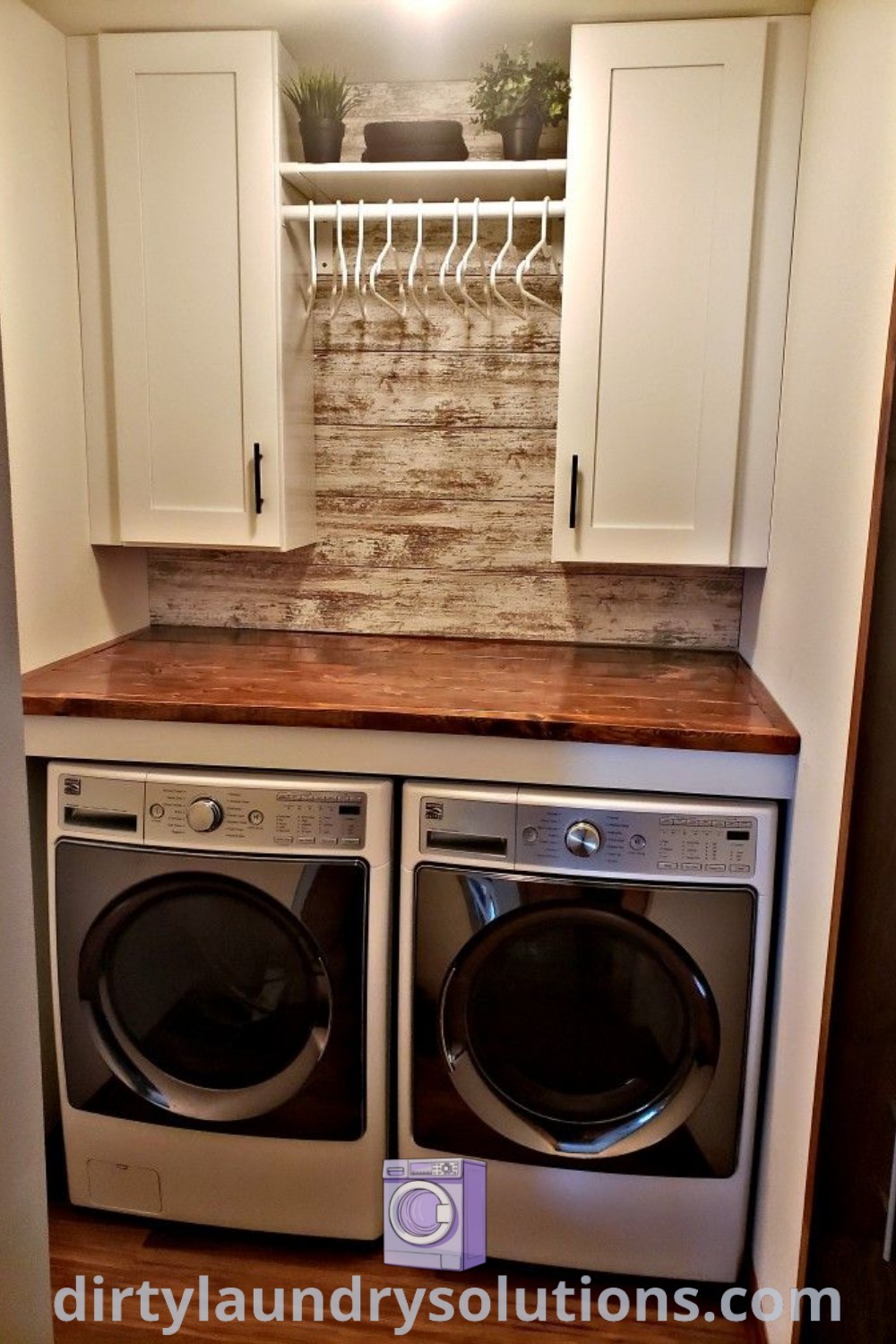 A cozy laundry room featuring a white washer and dryer with above cupboards, exemplifying organization ideas for small spaces. Discover unique design inspirations and solutions for cozy homes at dirtylaundrysolutions.com.