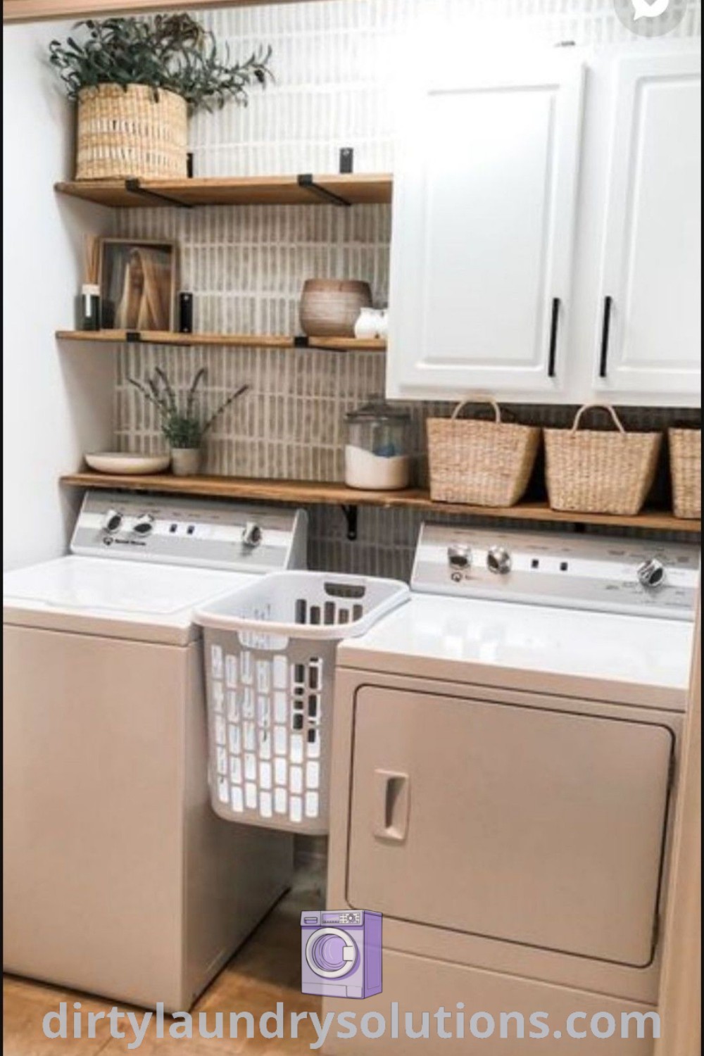 A small laundry room with a washer and dryer between open shelving, emphasizing laundry room organization ideas, and showcasing solutions for busy homes. Discover inspiring designs and tips at dirtylaundrysolutions.com.