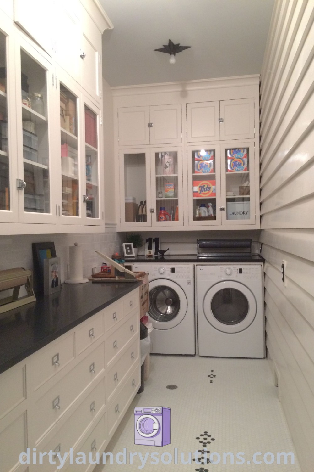 A cozy butlers pantry with a washer and dryer, ample cabinet space, and organizational ideas for small laundry areas. Explore practical pantry washer dryer combos and unique ideas for your home at dirtylaundrysolutions.com.