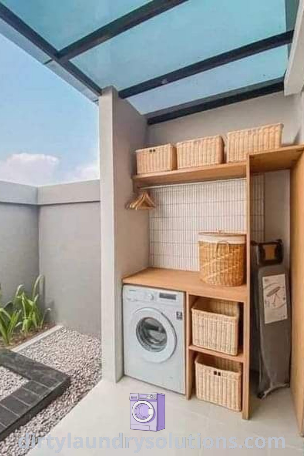 An outdoor laundry room with a washer and dryer under a glass roof, showcasing modern design ideas and organization solutions. Discover inspiring backyard designs and laundry room layouts at dirtylaundrysolutions.com.