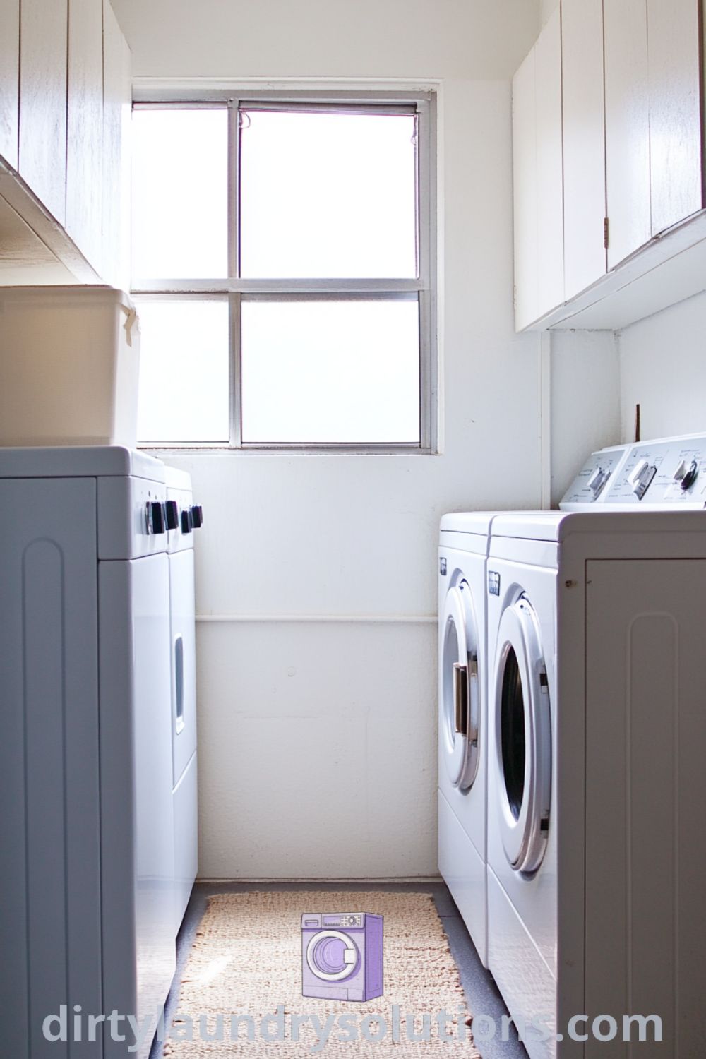 Cozy laundry room with washer and dryer nestled between white cabinets, highlighting sunlit imperfections and a soft woven rug for warmth. Discover inspiring ideas for small spaces and organization at dirtylaundrysolutions.com.