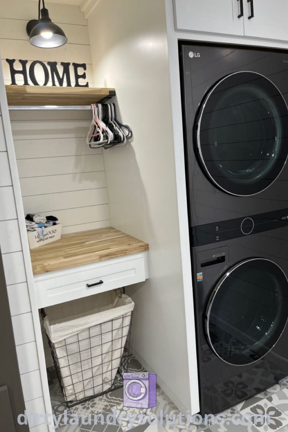 A laundry room showcasing a stackable washer and dryer with a folding table and shelves, highlighting functional organization ideas. Explore farmhouse laundry room designs and small space solutions at dirtylaundrysolutions.com.