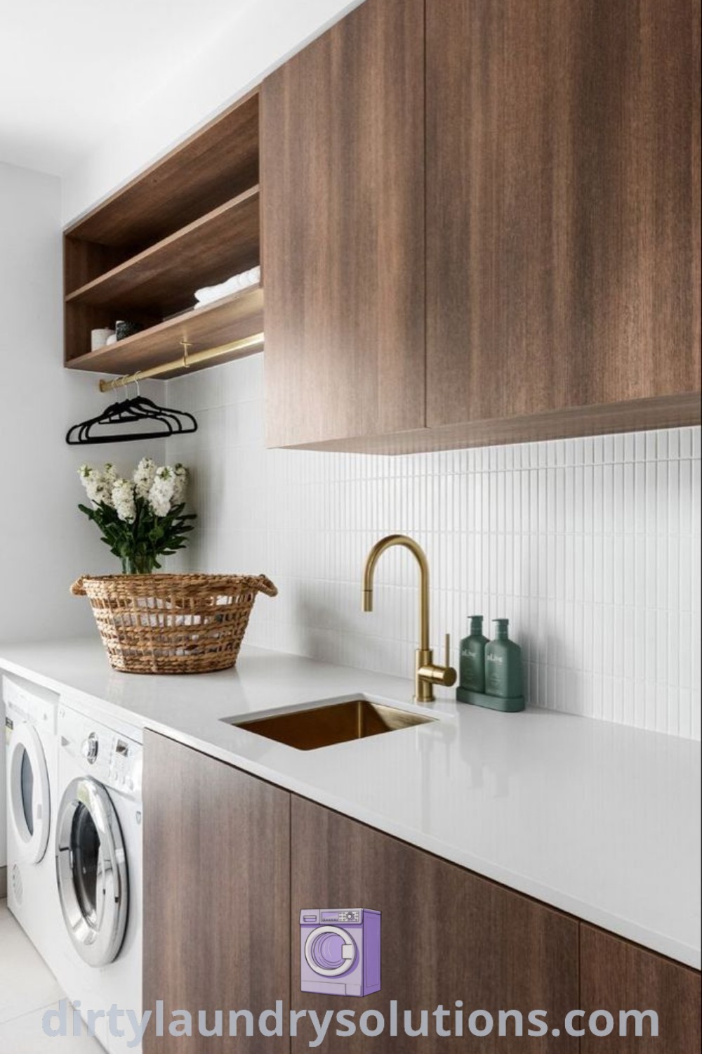 A modern laundry room featuring a washer, dryer, and cabinets on white tile flooring, designed for efficiency and style. Discover inspiring laundry room renovation ideas and practical solutions at dirtylaundrysolutions.com.