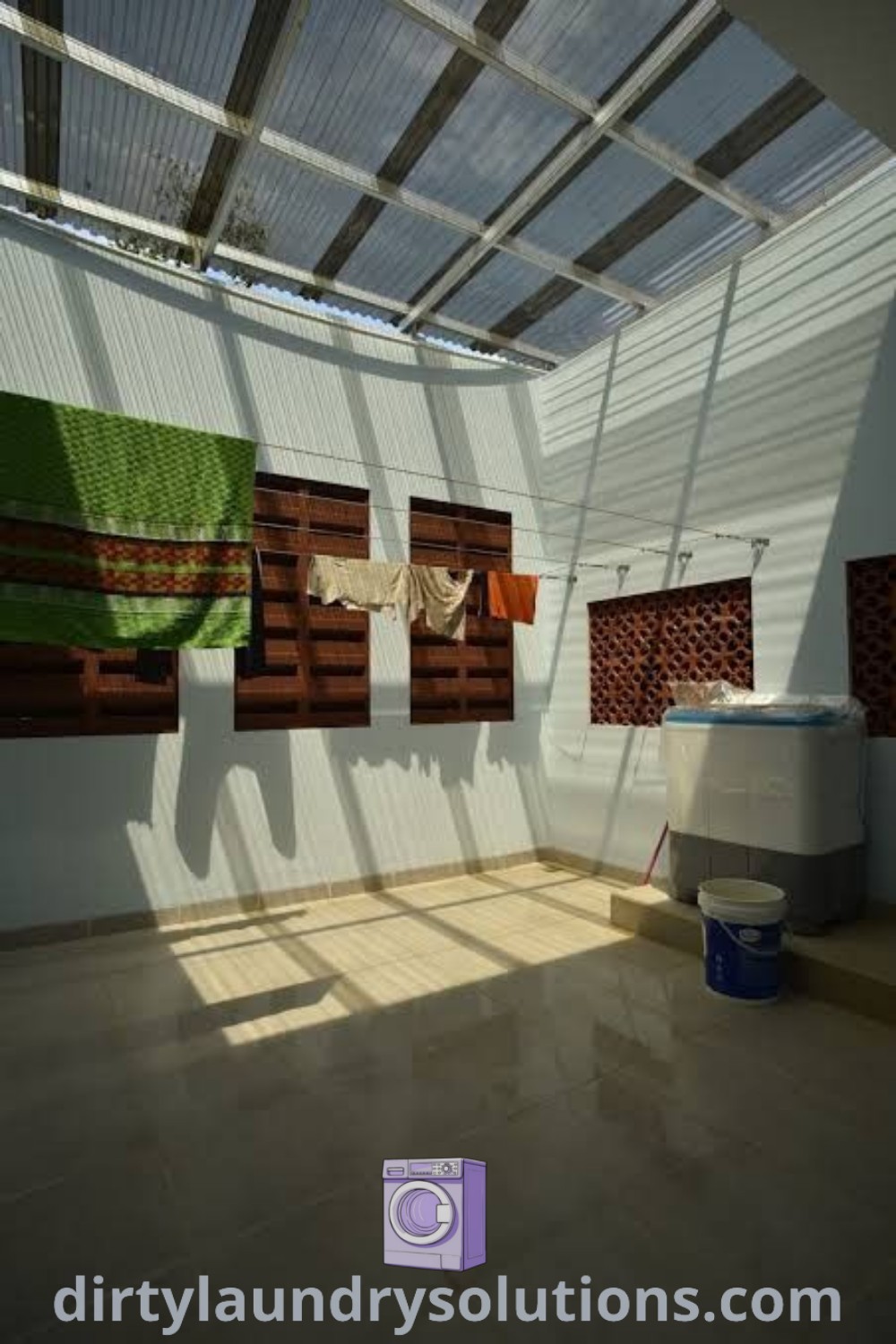 An outdoor laundry room filled with artistic decor and two buckets, showcasing cozy home vibes and unique ideas for small spaces. Explore more outdoor laundry room ideas at dirtylaundrysolutions.com.