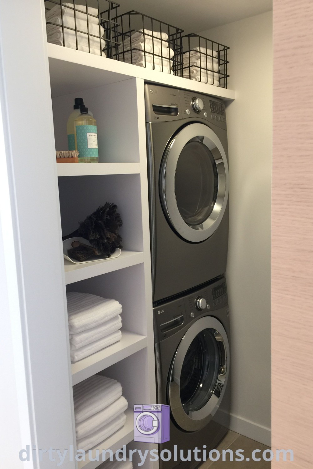 A stylish small laundry room featuring a stackable washer and dryer with stainless steel shelves on the wall, providing cozy organization ideas. Discover more inspiring solutions at dirtylaundrysolutions.com.