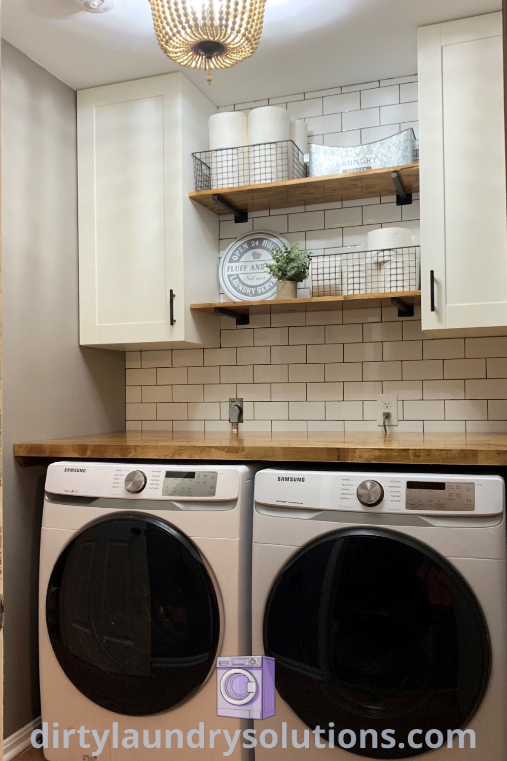 A cozy laundry room featuring a white washer and dryer in a small space, with white cupboards on the wall for optimal organization. Discover inspiring ideas for your home at dirtylaundrysolutions.com.